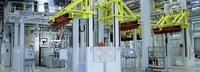 Friction wheels transport large gearboxes for painting
